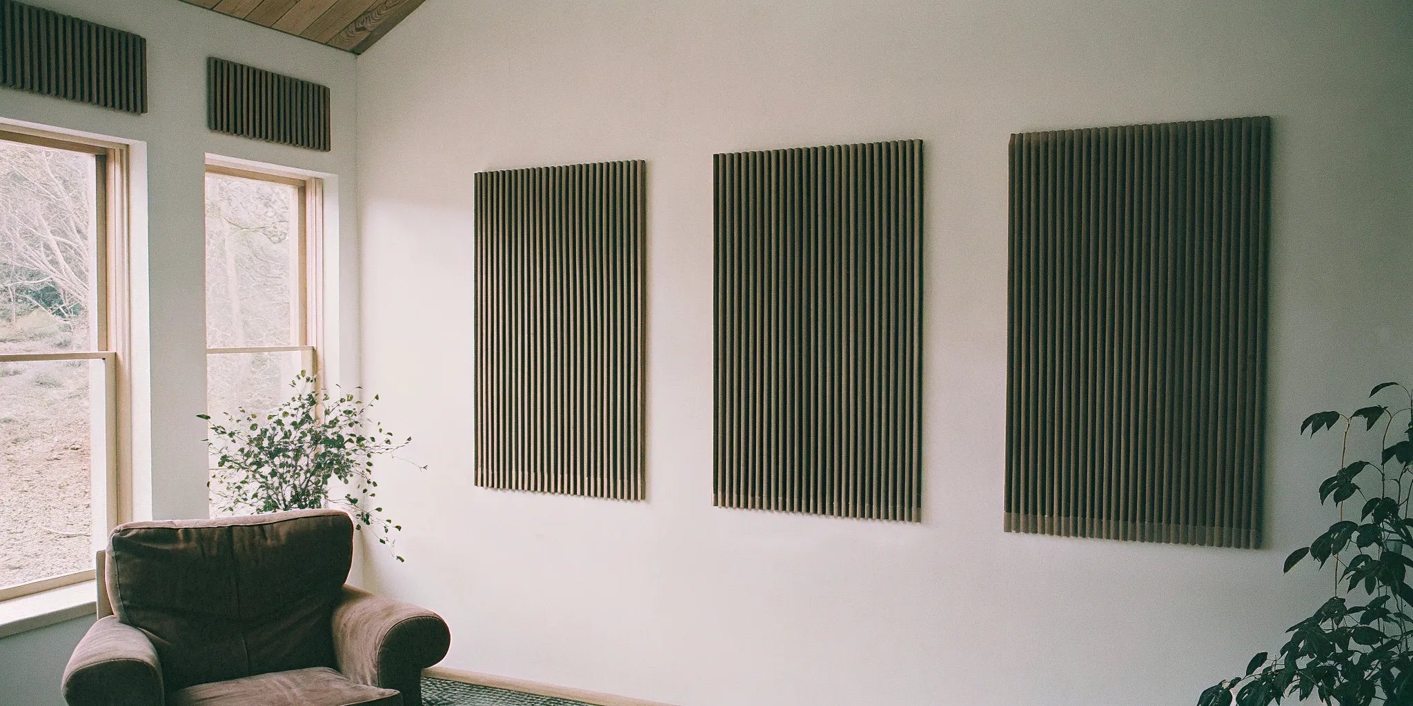 A modern wall featuring the best acoustic wood panels for soundproofing.