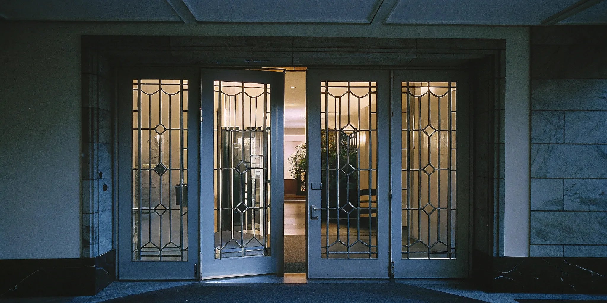 60x80 double steel entry doors with glass in a modern home entryway.