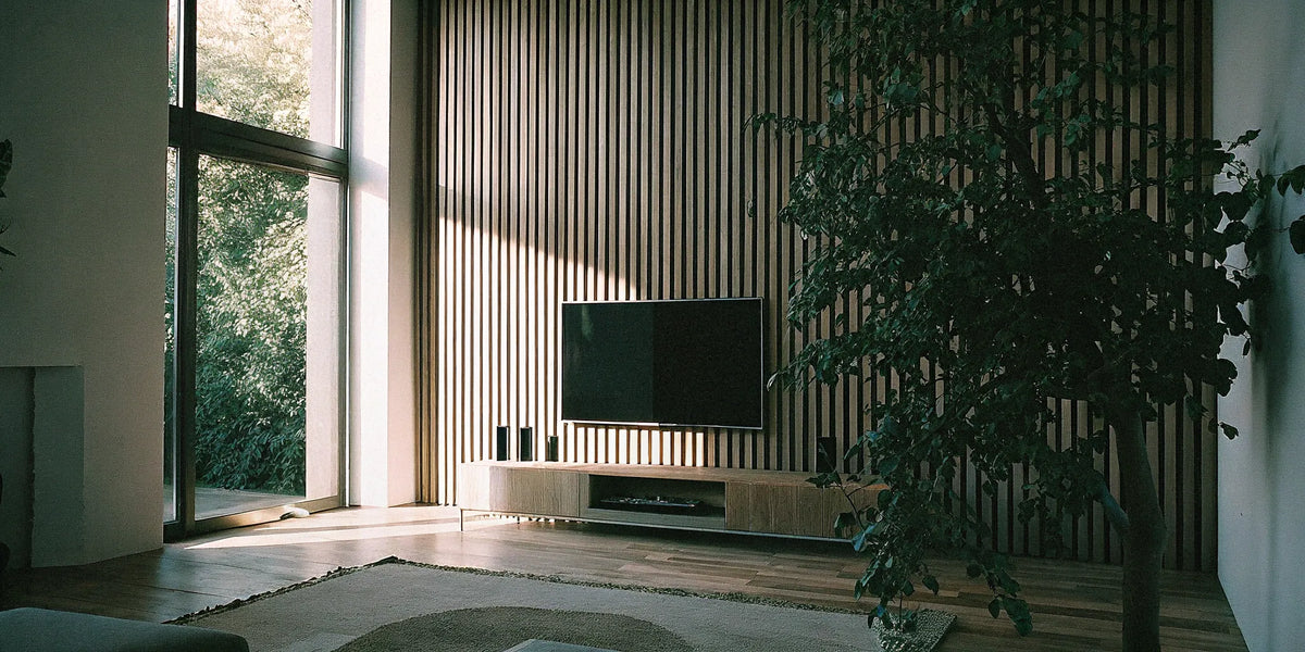 Slatted acoustic wood panels on a wall.