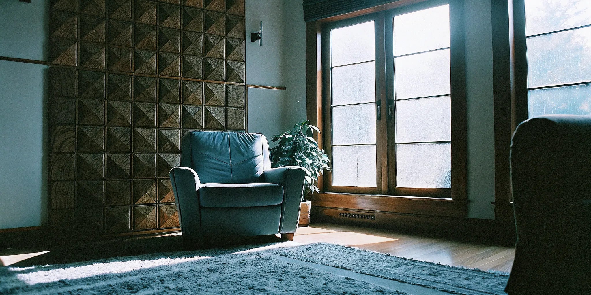 Acoustic wood panels on the wall of a modern, sunlit living room in Union Pier.