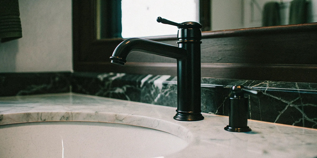 Sleek black faucet in a modern bathroom.