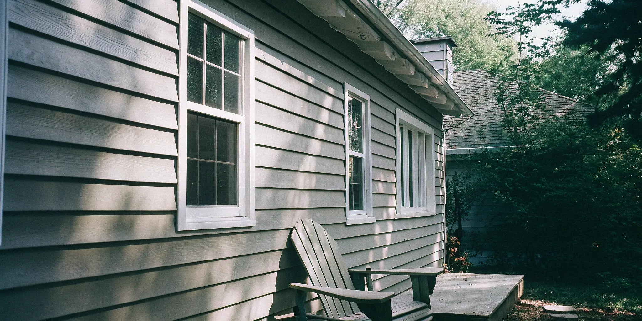 Gray exterior shiplap siding installed horizontally on a modern home.