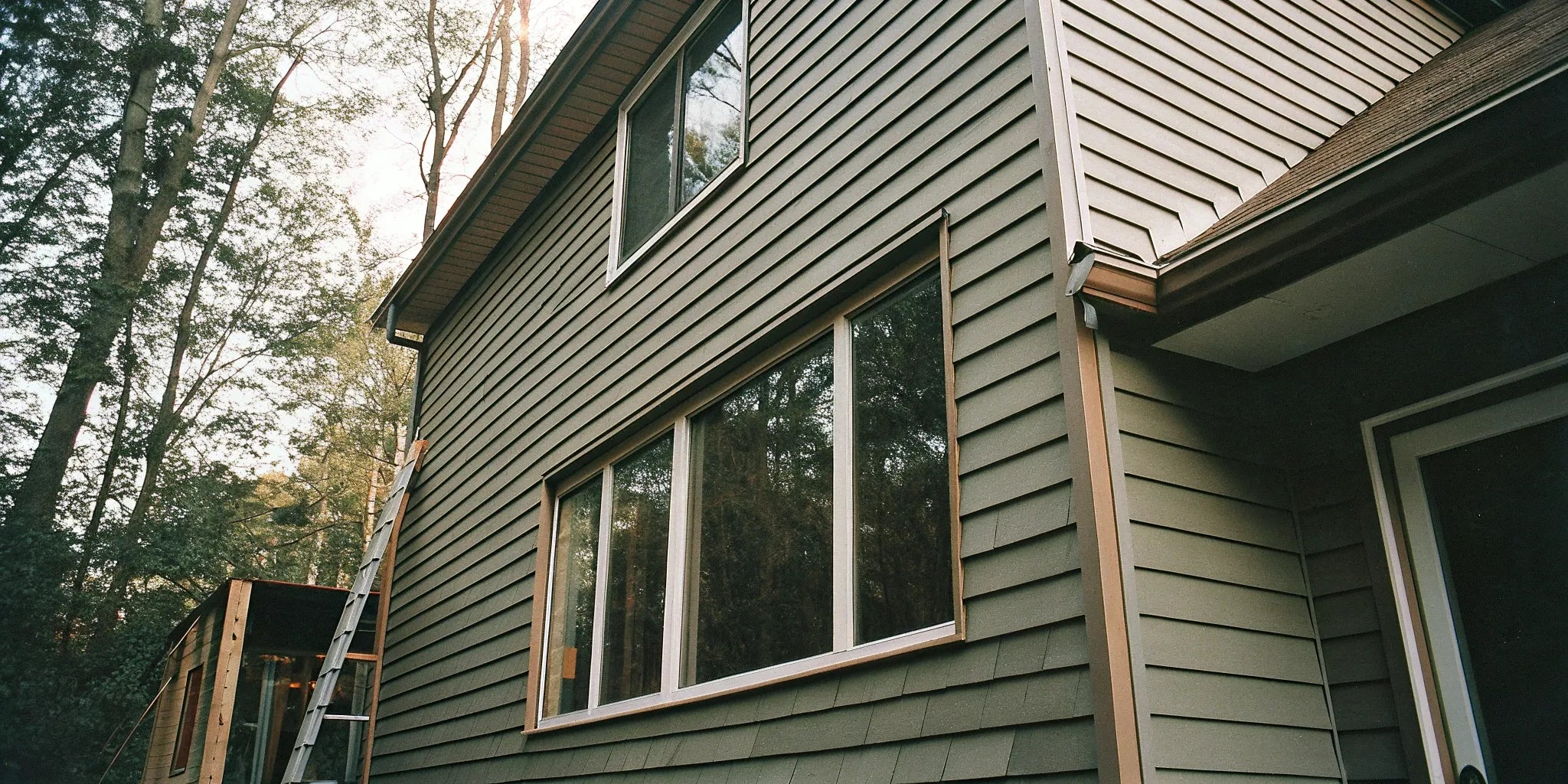 Considering the pros and cons of fiber cement siding on a modern home.