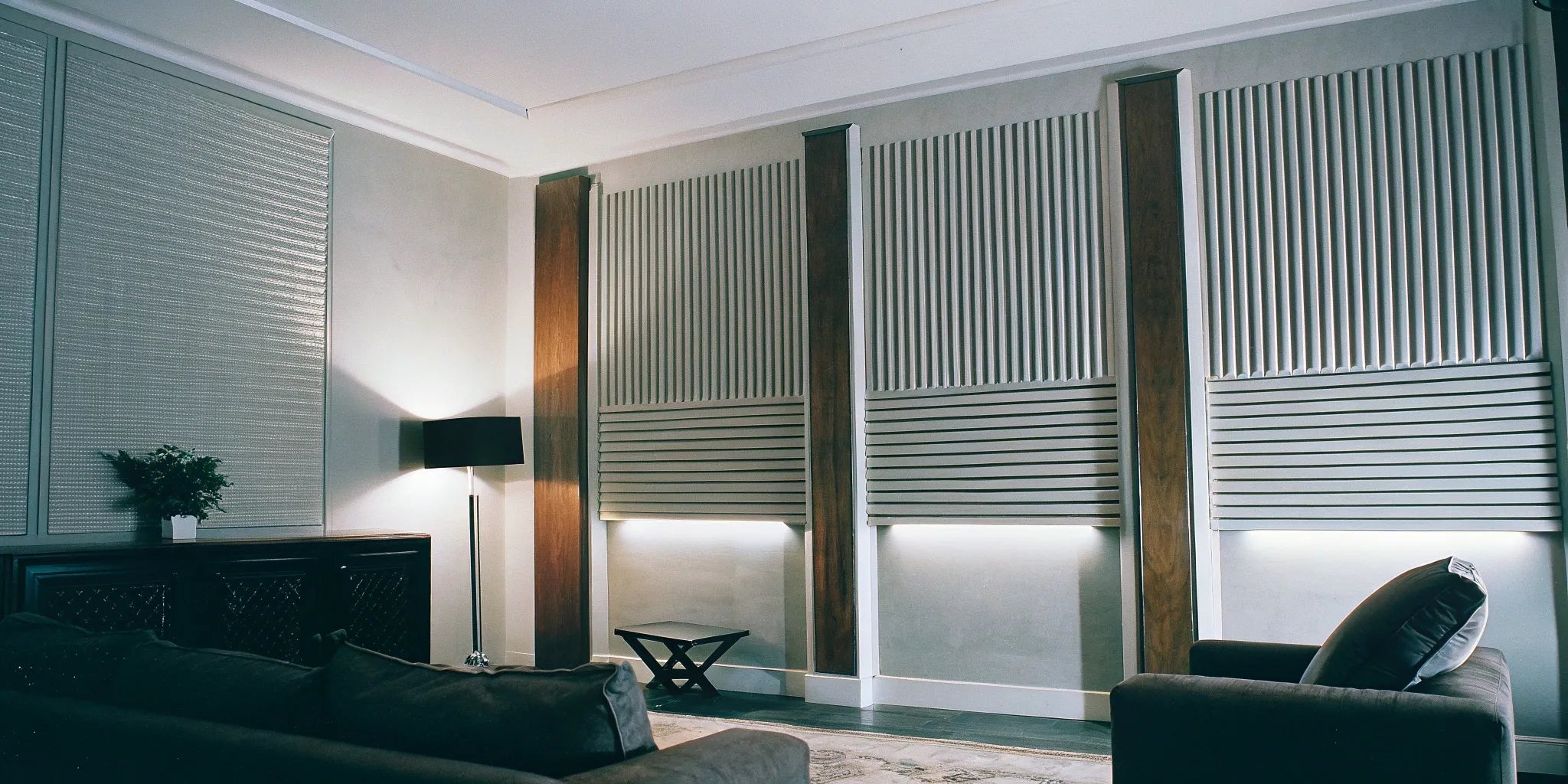 Flexible mdf fluted panels on a curved accent wall in a modern living room.