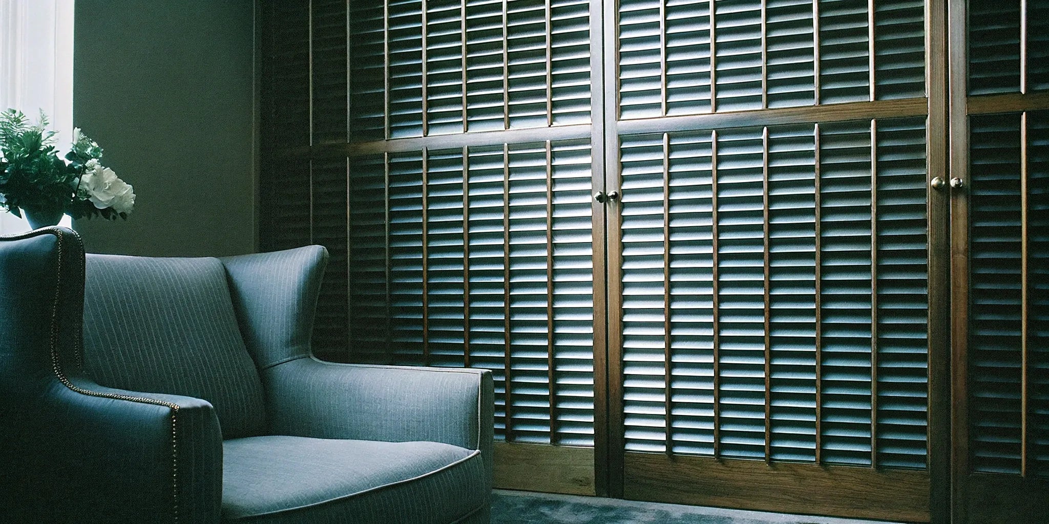 Natural fluted wood wall panels creating a modern accent wall.