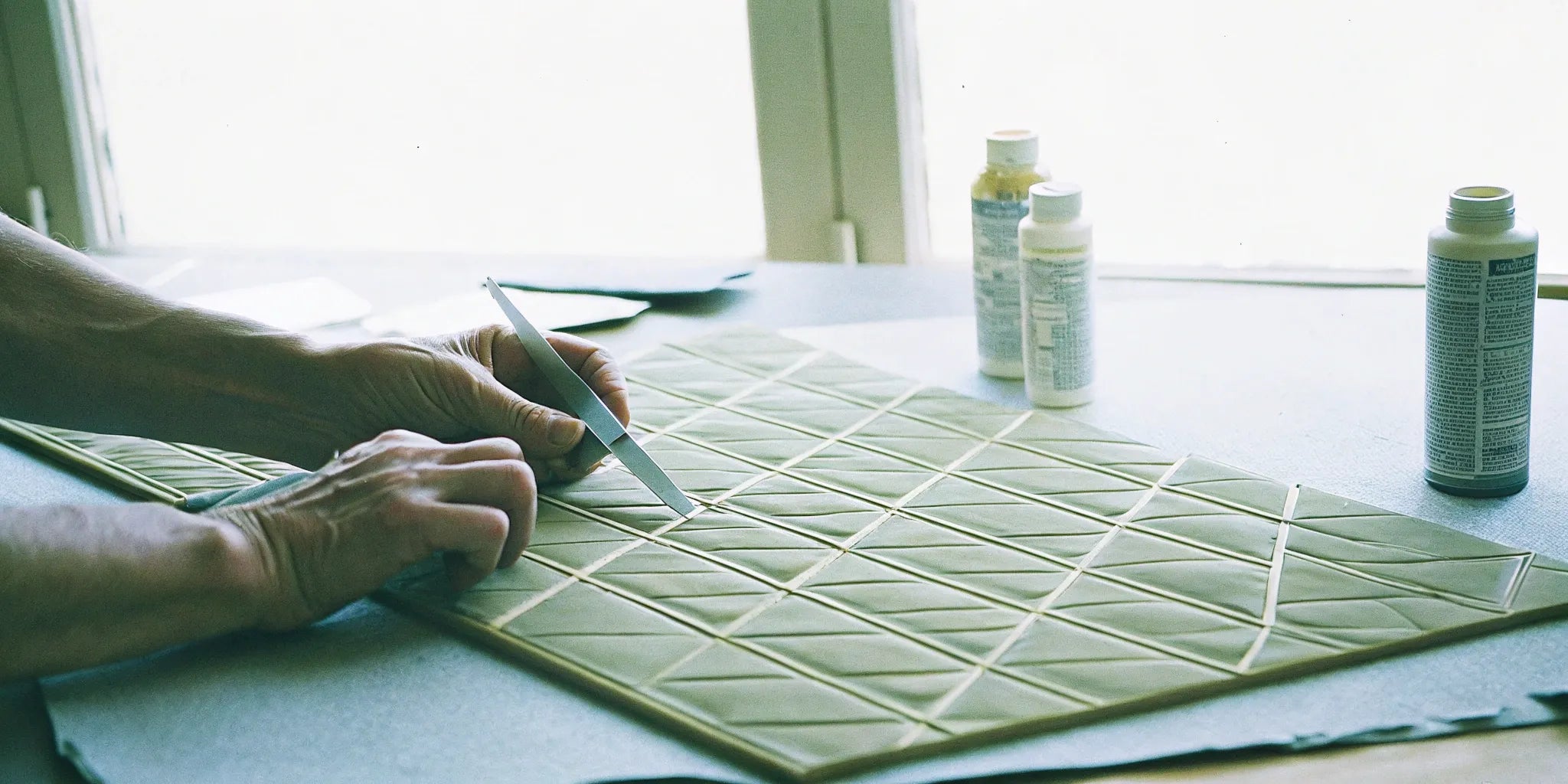 Cutting a 3d wall panel to prepare for adhesive installation.