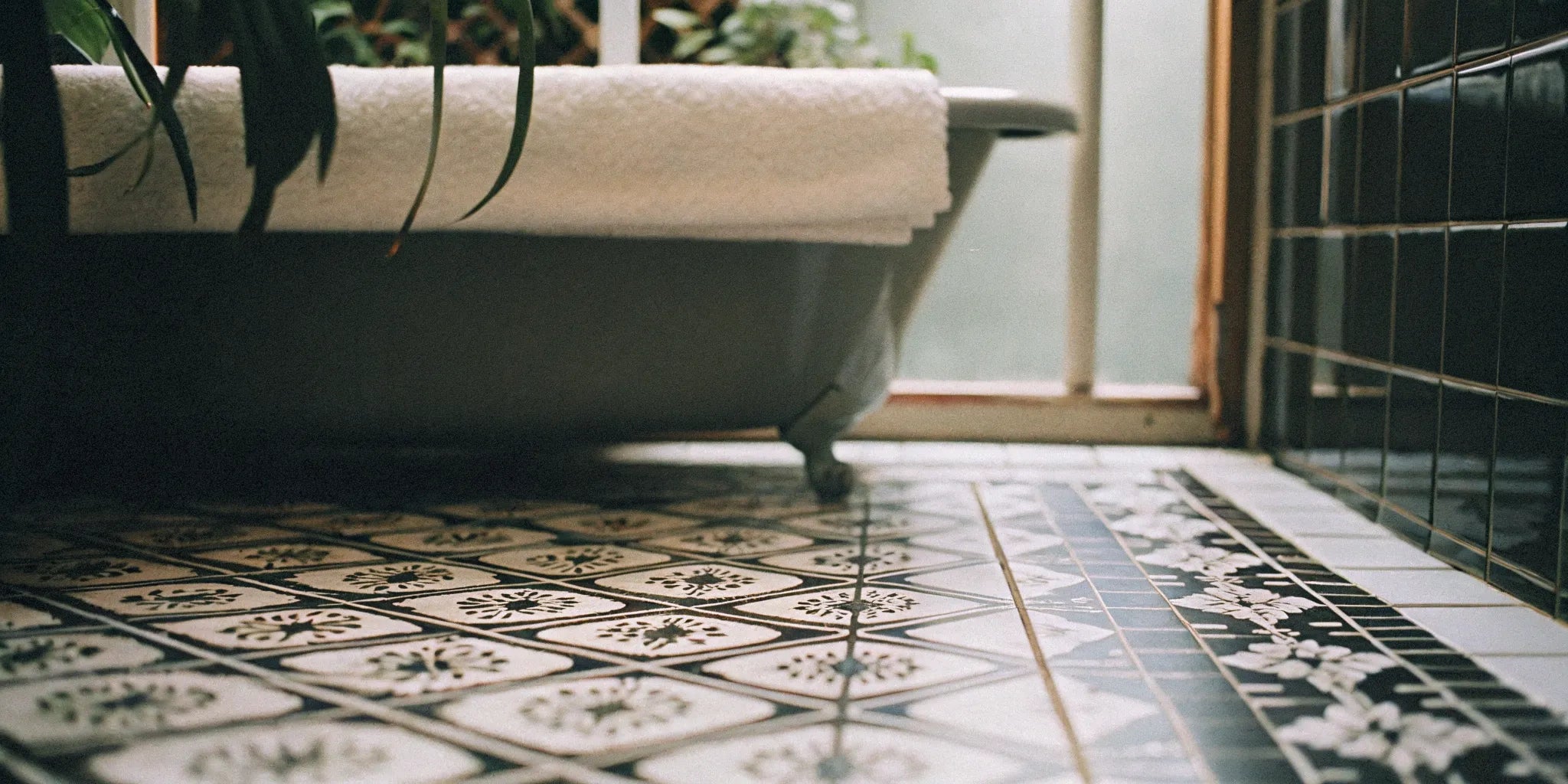 Decorative porcelain floor tiles in a modern bathroom.
