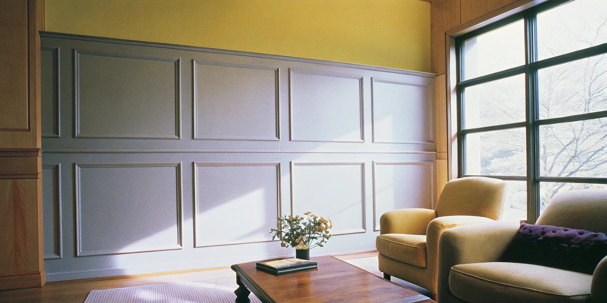 A modern accent wall created with smooth, paintable wall paneling.