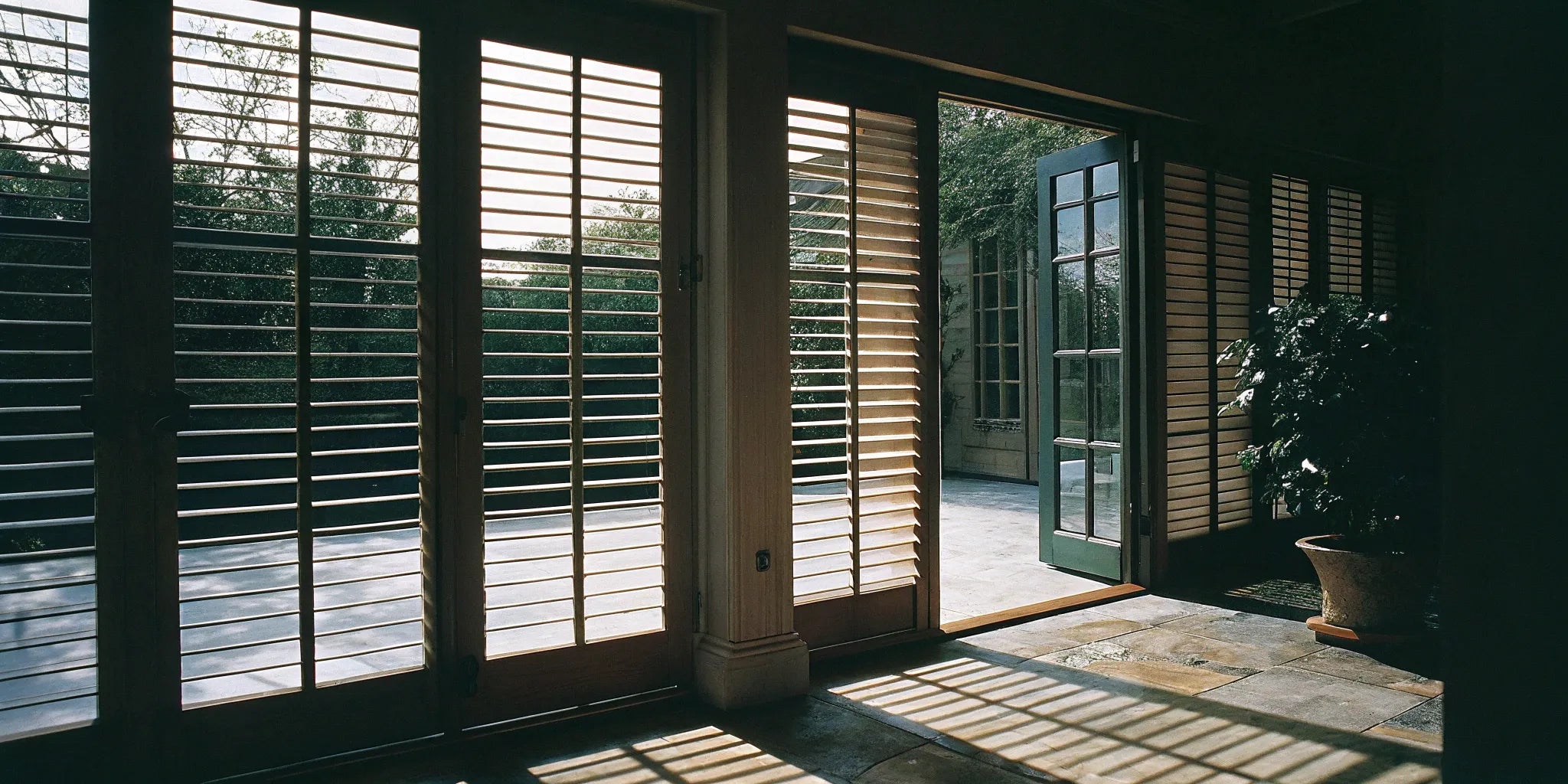 Modern steel French doors with built-in blinds for controlling light and privacy.