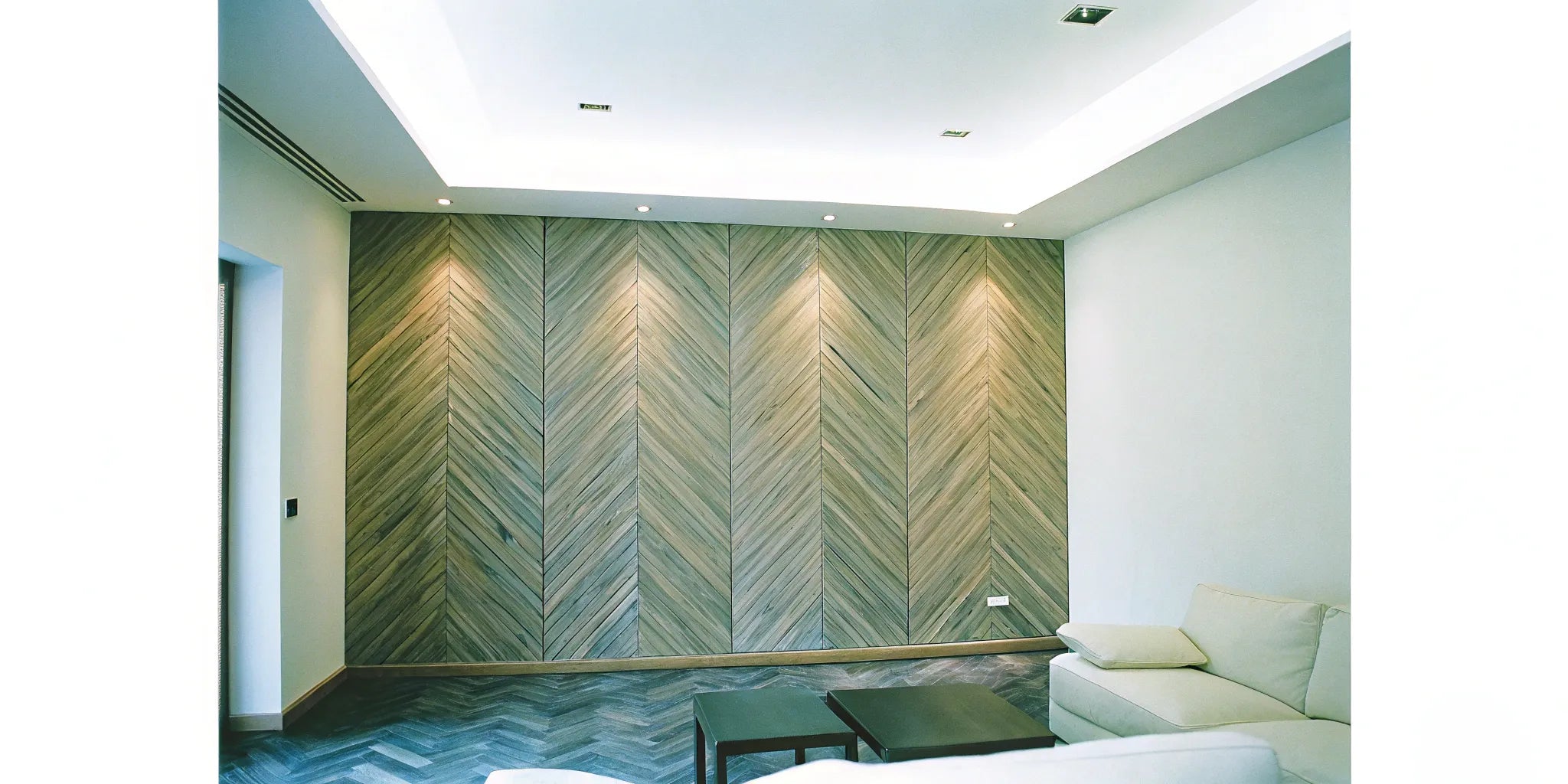 Modern living room with walnut acoustic wood wall panels.