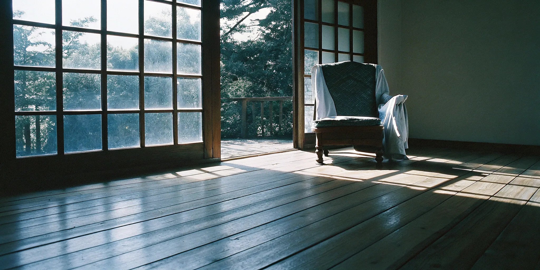 Wide plank engineered flooring installed in a bright, sunlit room.