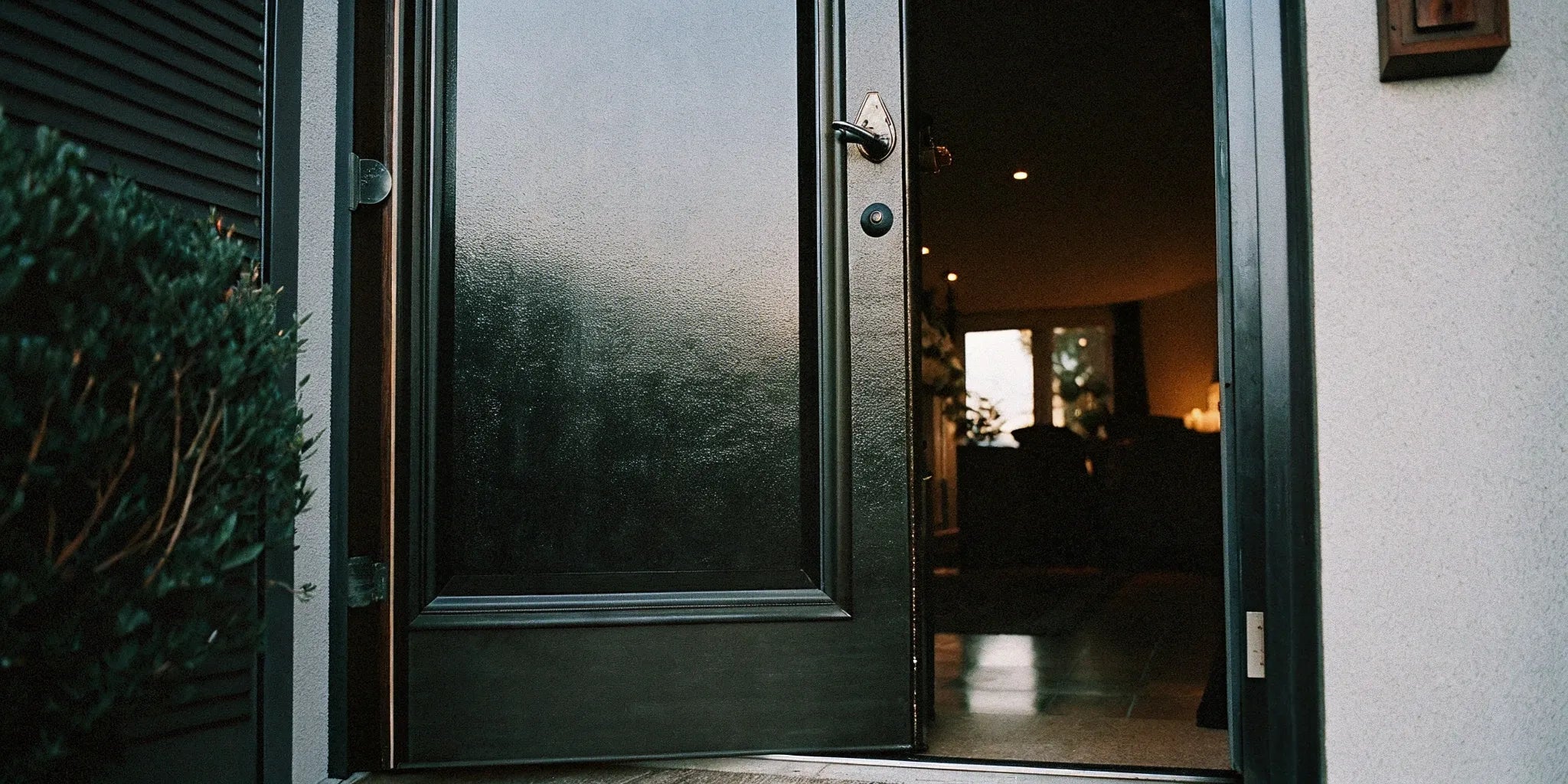 A secure and stylish 36x96 single steel door installed in a modern home entryway.