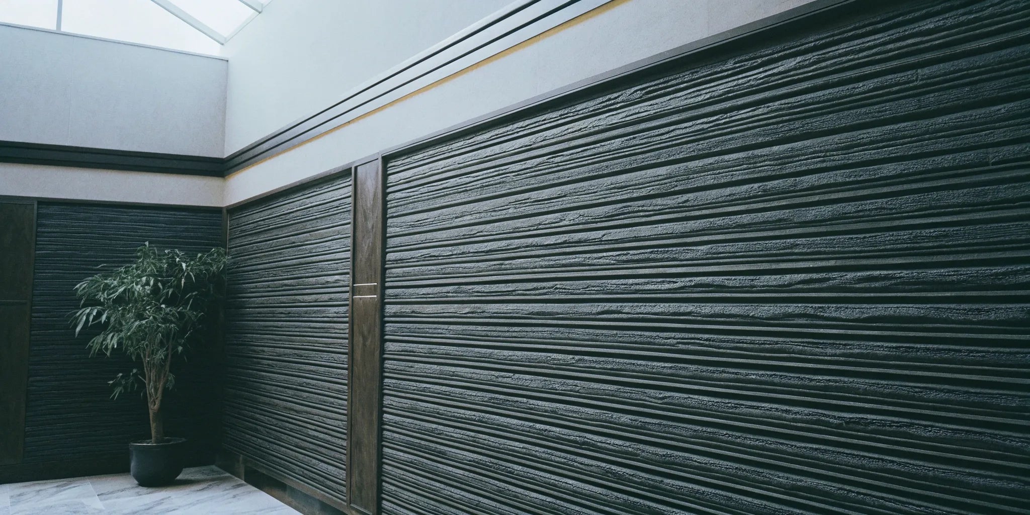 WPC fluted panels create a textured, modern wall.