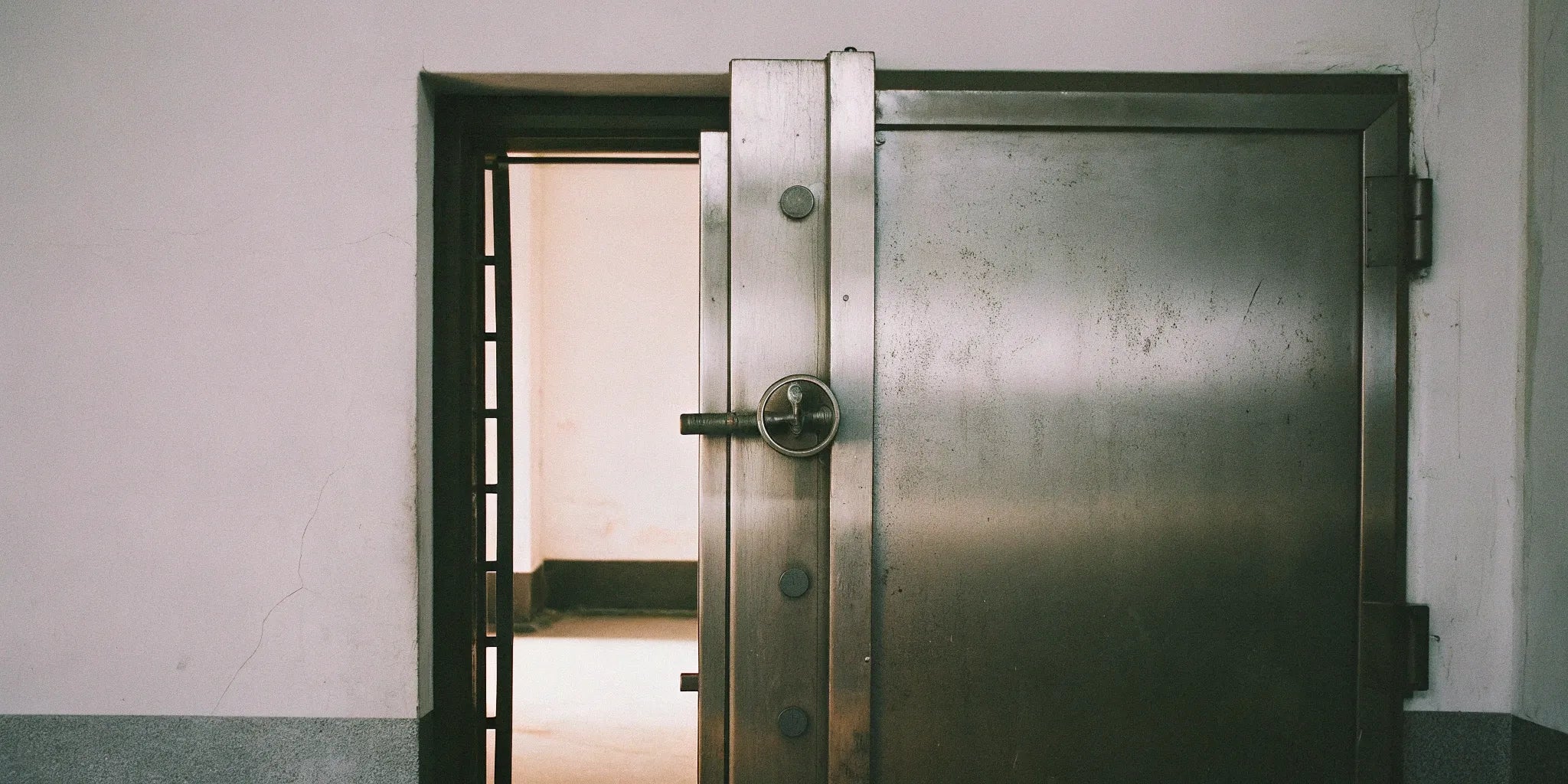 A 36x80 single steel door, open to show its durable construction and secure lock.