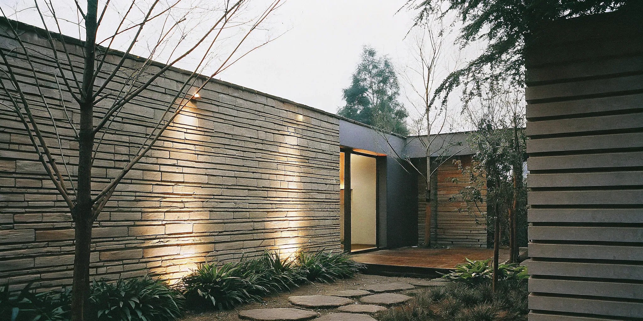 3D stone wall panels create a modern exterior.
