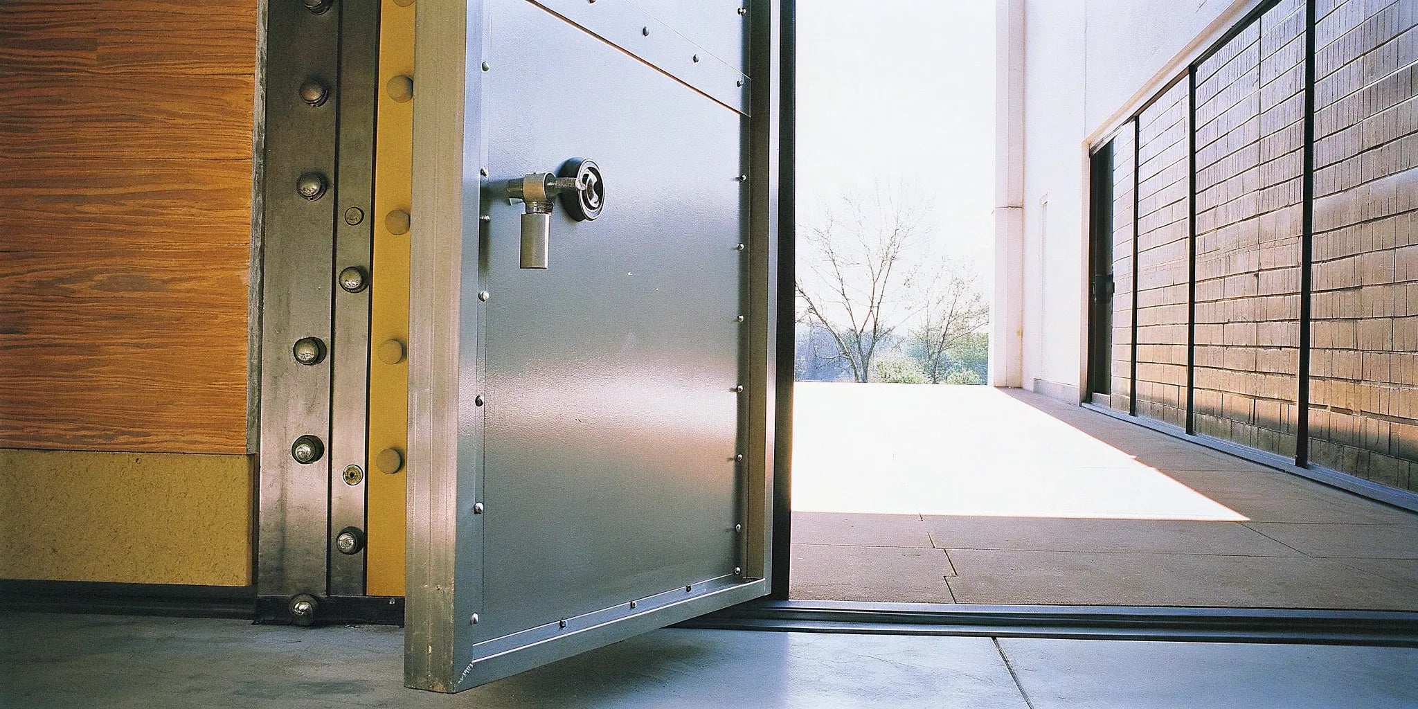 An open commercial steel security door providing durable protection for a business.