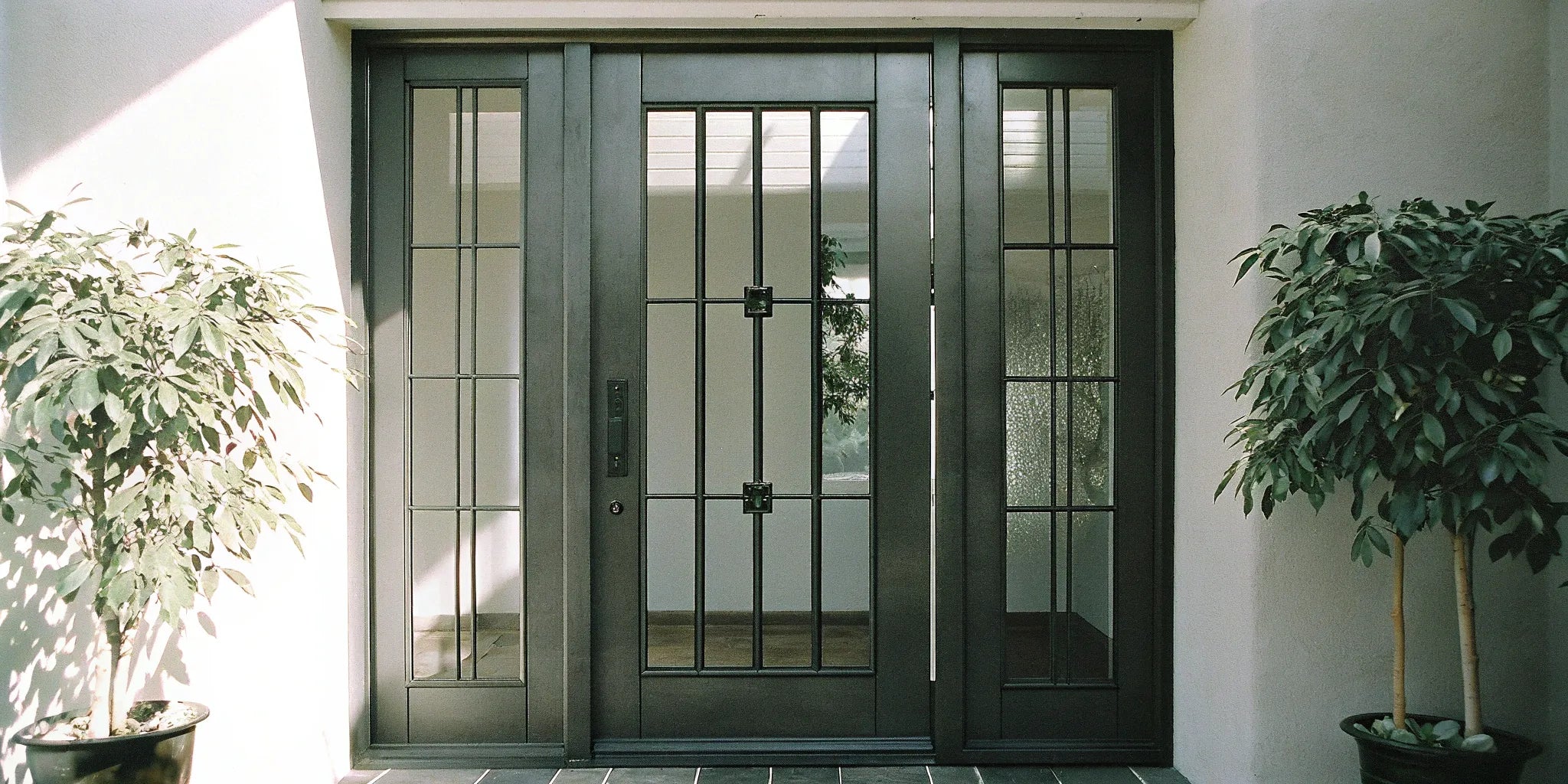 Price breakdown for a black steel door with sidelights.