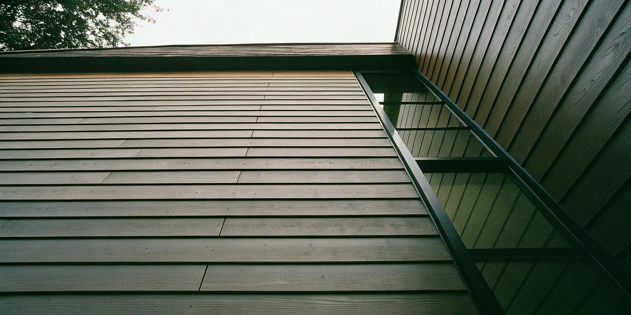 A modern building with sleek, horizontal fiber cement cladding panels.