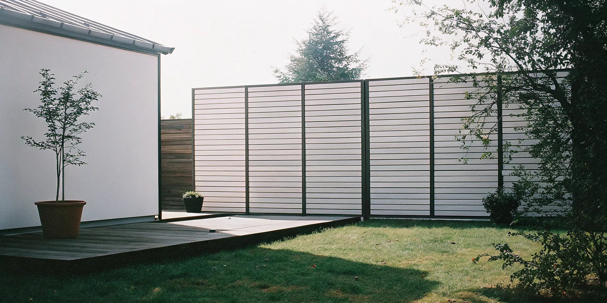 A sleek outdoor fluted panel design creates a modern fence with clean lines.