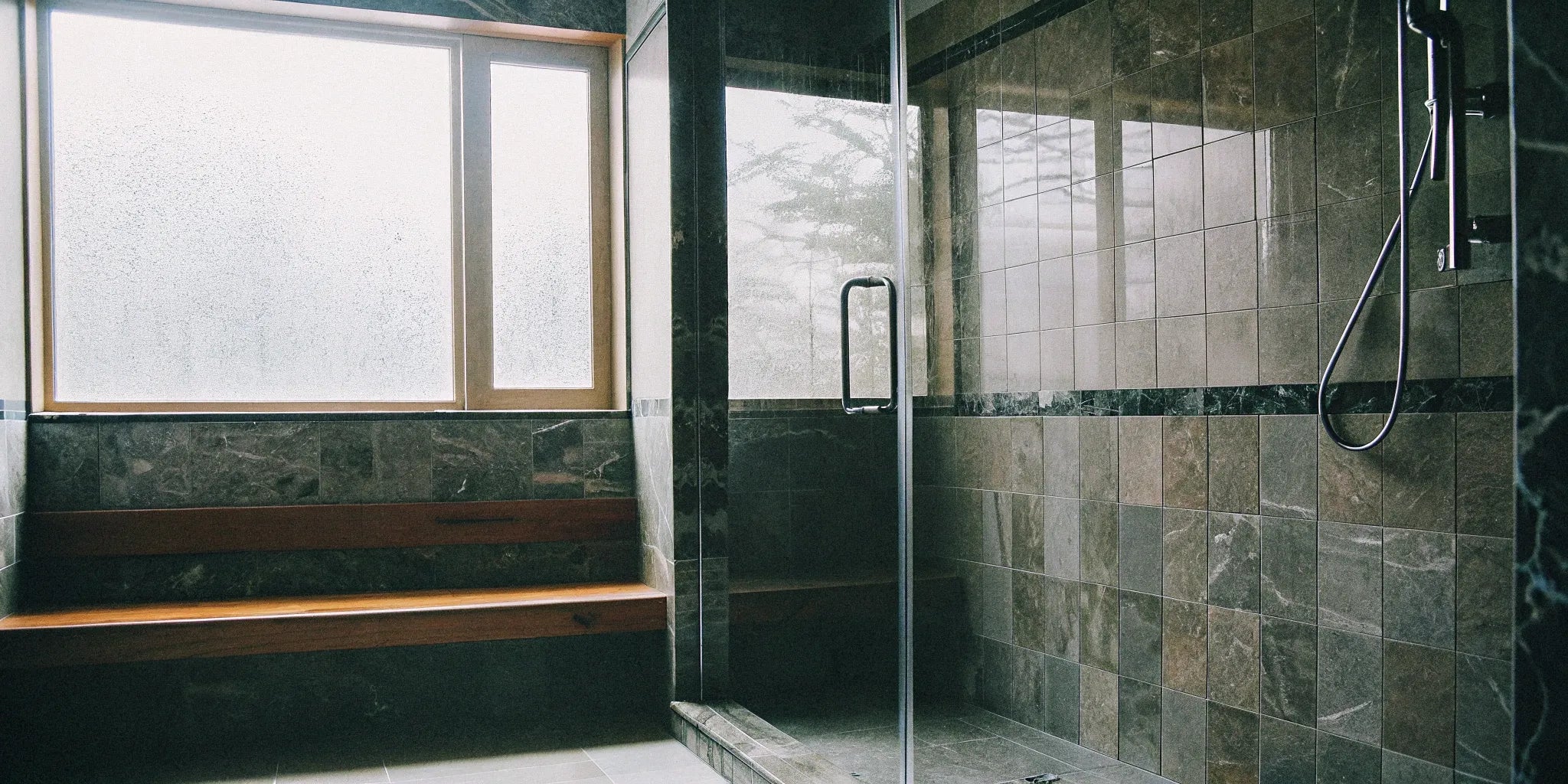 Porcelain slab shower walls create a sleek, modern bathroom.