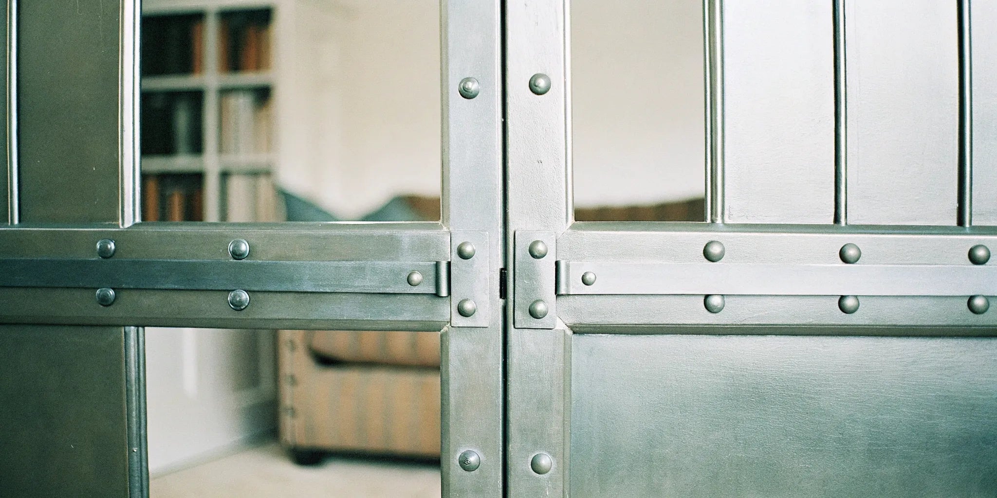 Modern steel door with rivets.