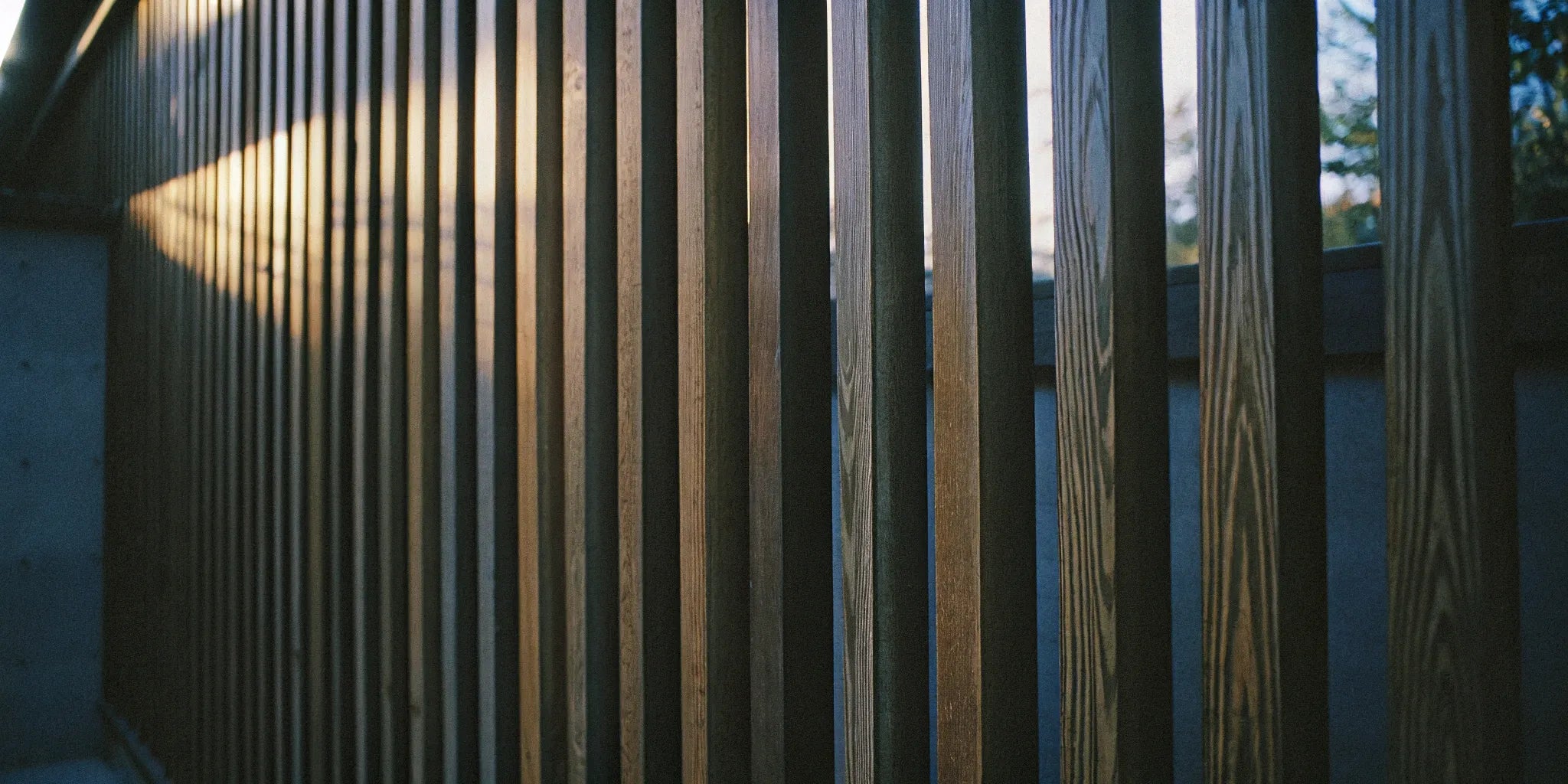 Vertical wood slat wall panels add warmth and texture.