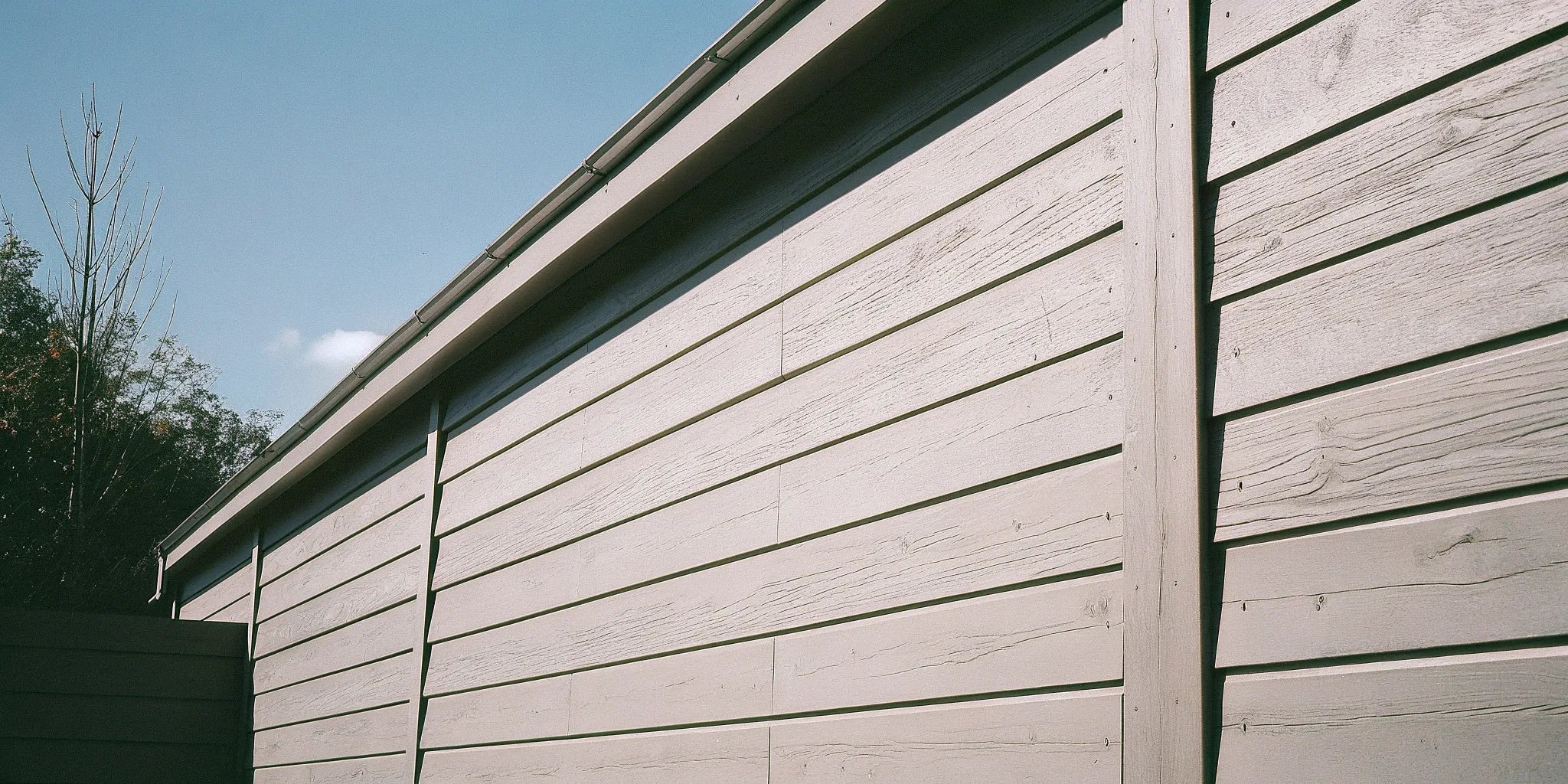 Exterior cement board panels installed as durable siding on a modern building.