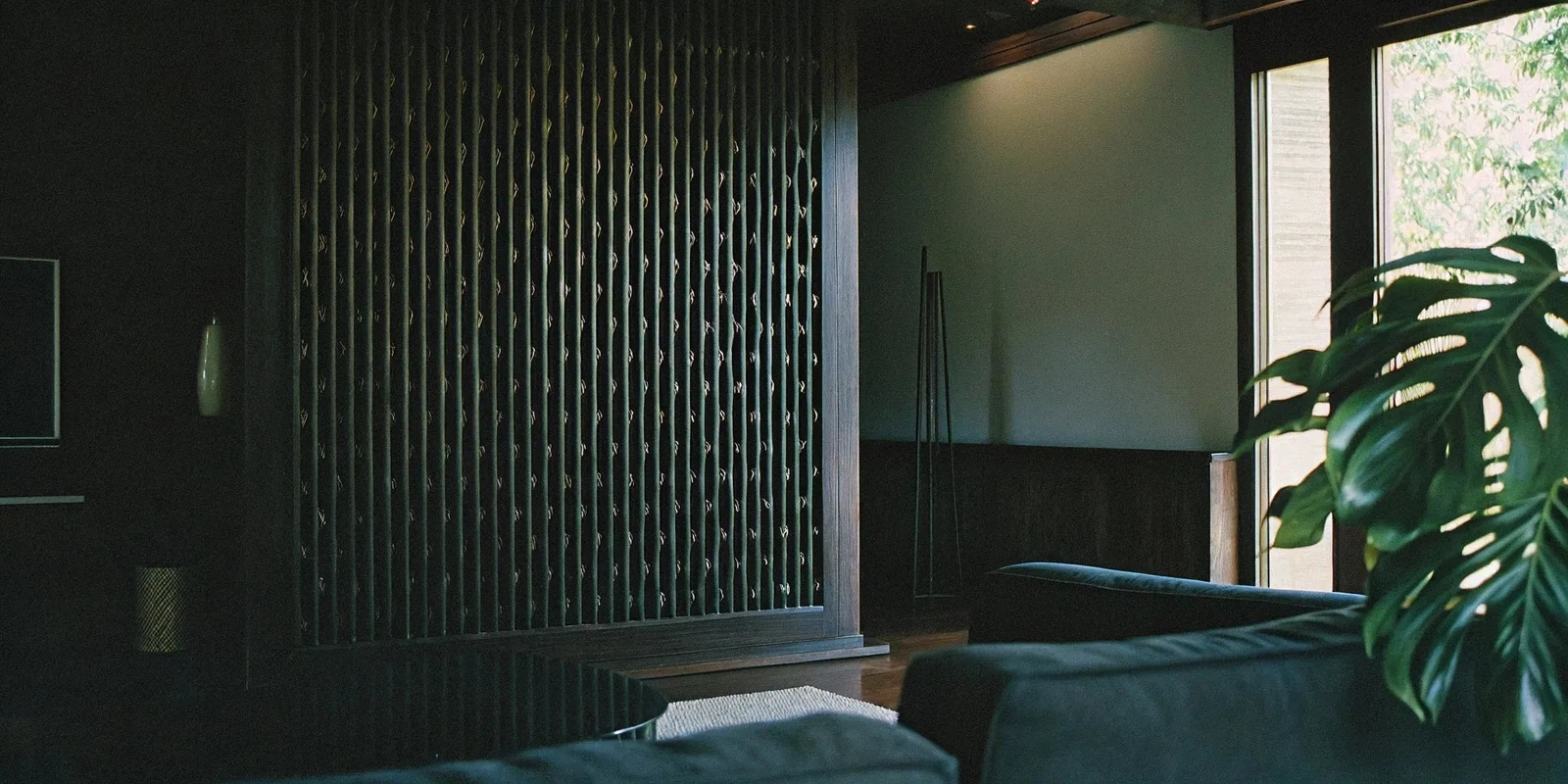 A decorative slat wall panel used as an accent wall in a modern living room.