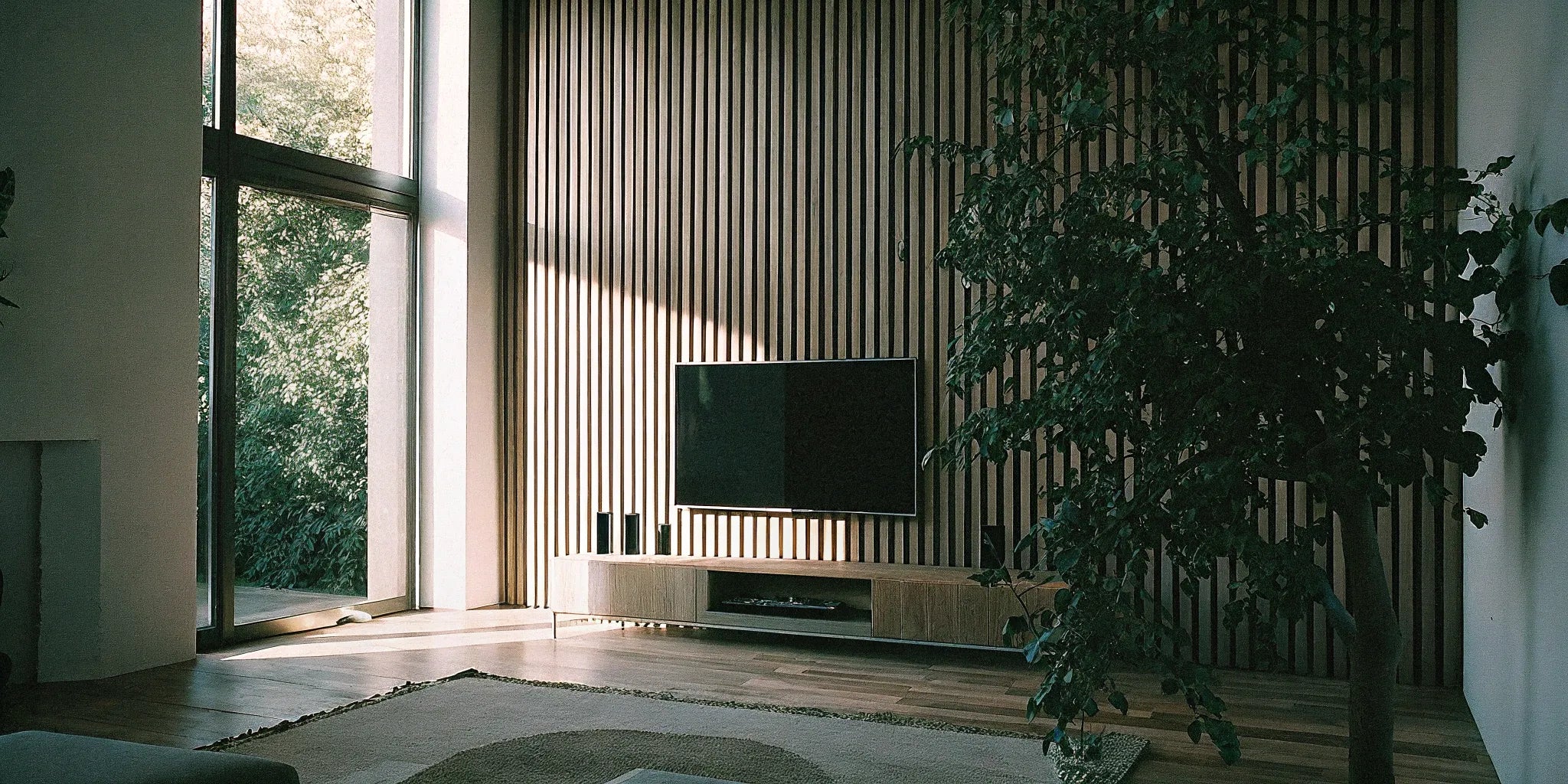 Slatted acoustic wood panels on a wall.